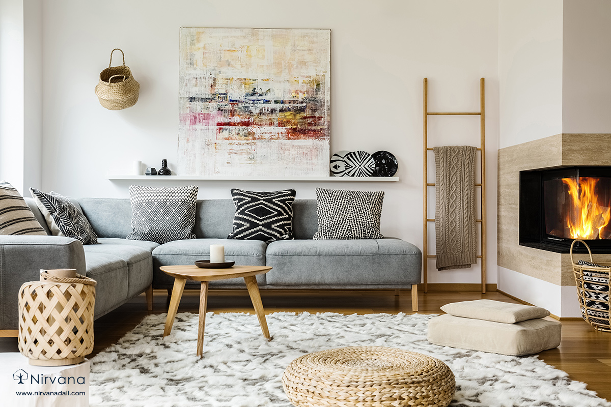 A living room filled with furniture and a fire placeDescription automatically generated