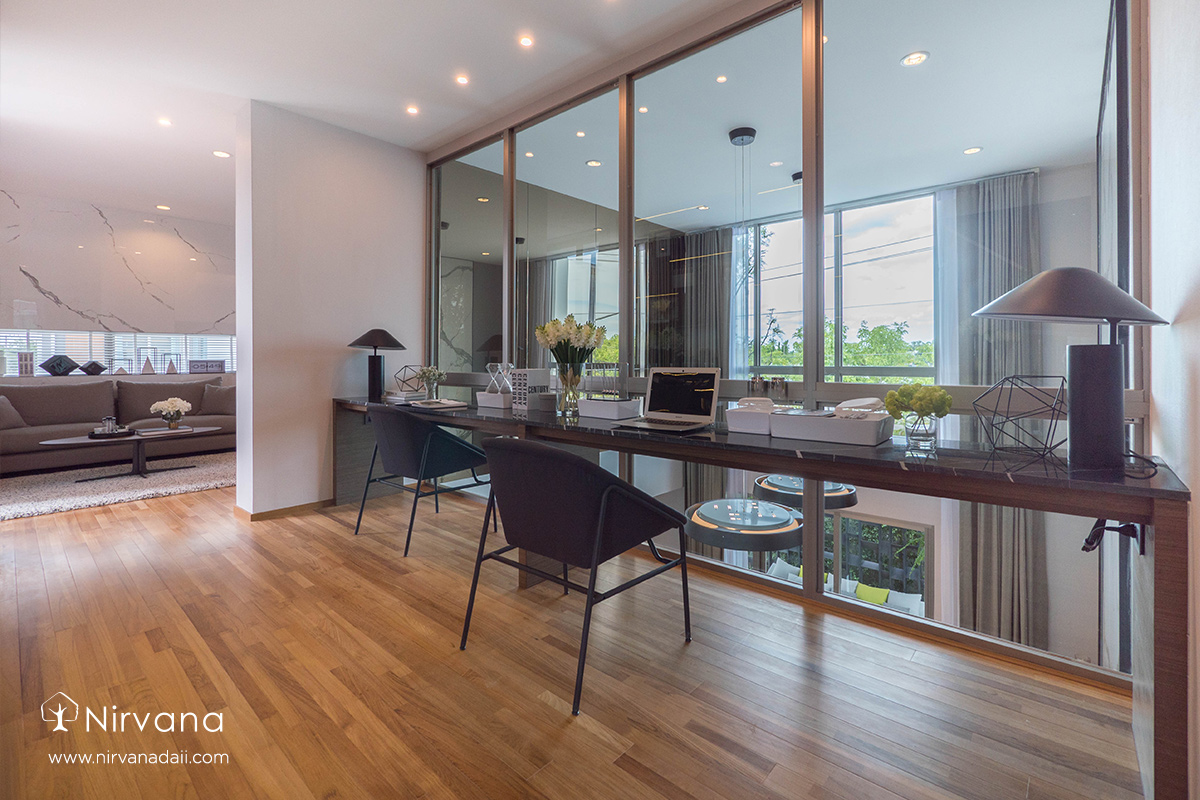 A living room filled with furniture and a large windowDescription automatically generated